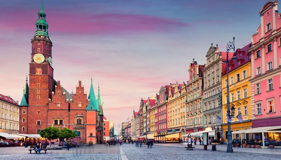 Historic market square of a Polish old town at dusk